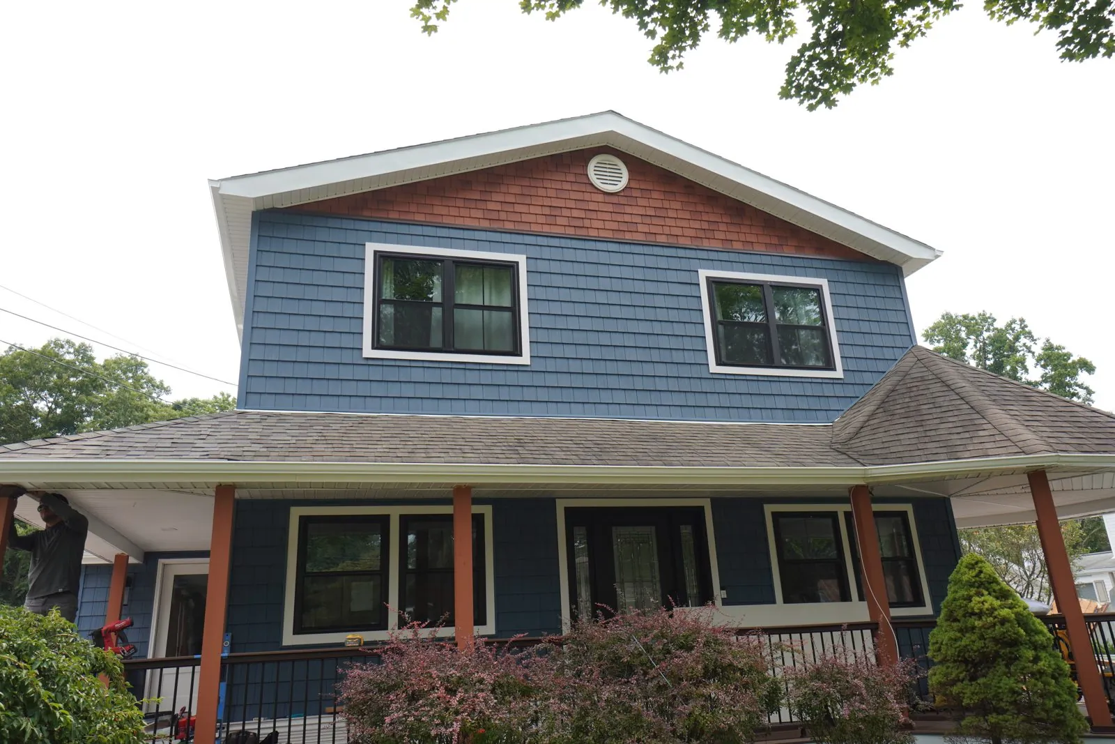 New siding and window trim on a Long Island front elevation by Alec's Construction